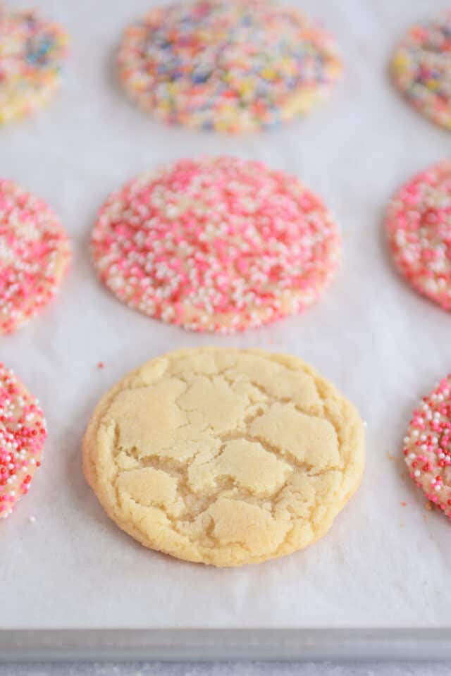 Baked sugar cookie on sheet pan.