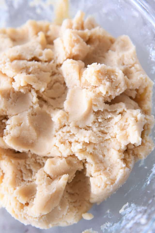 Glass bowl with mixed sugar cookie dough.