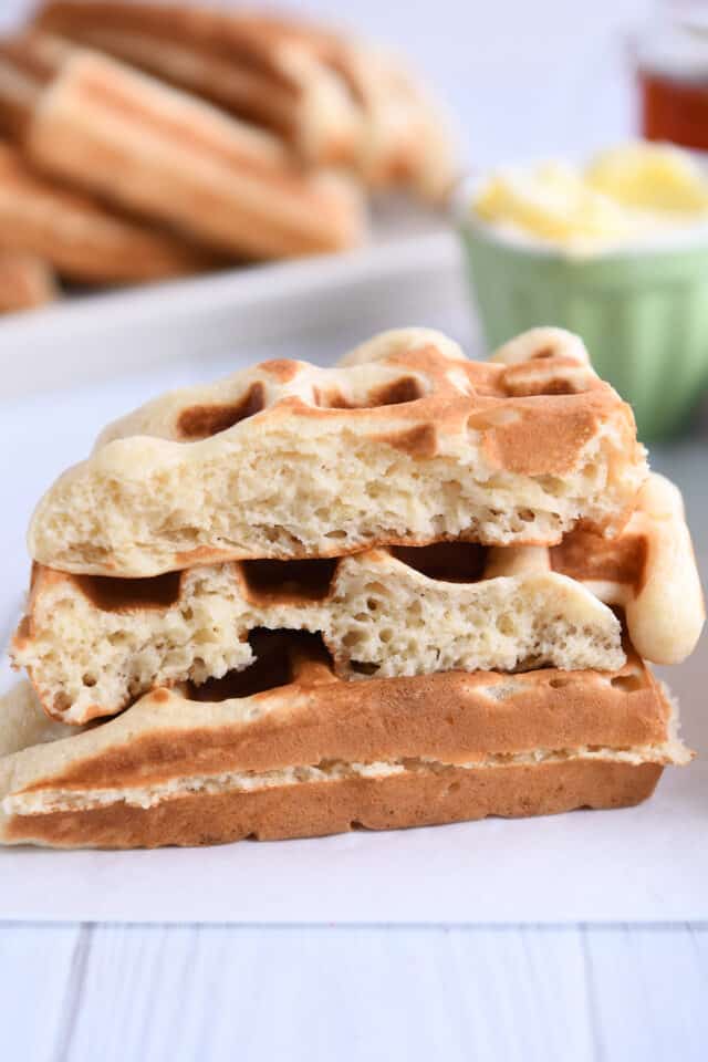 Waffle split in half stacked on another waffle.