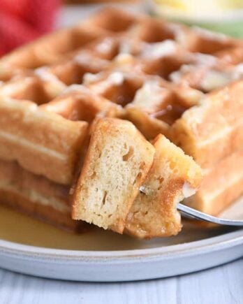 Fork with bite of waffles.