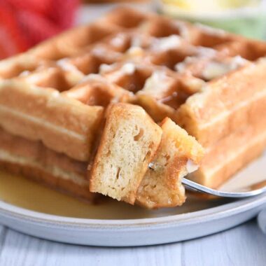 Fork with bite of waffles.