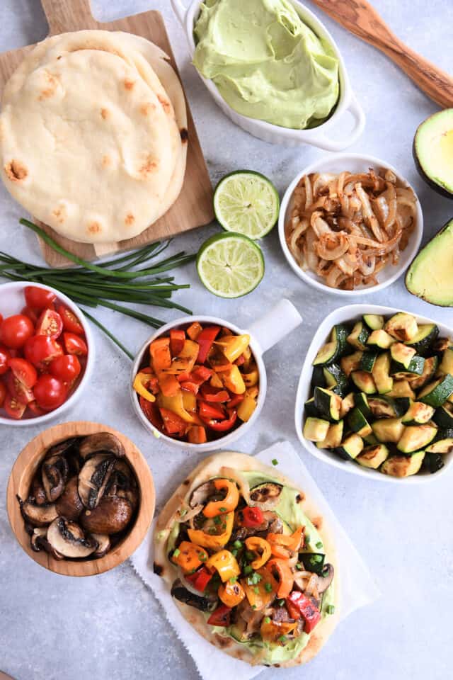 Flatbread, scallions, lime, caramelized onions, roasted zucchini, mushrooms and red peppers.
