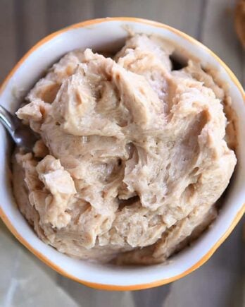 Cinnamon honey butter in bowl with knife.