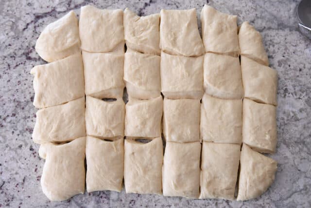 Rectangle of dough cut into 24 pieces.