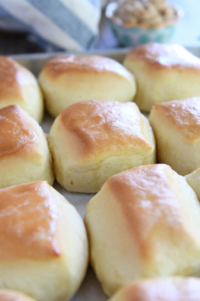 Baked and buttered square roll on sheet pan.