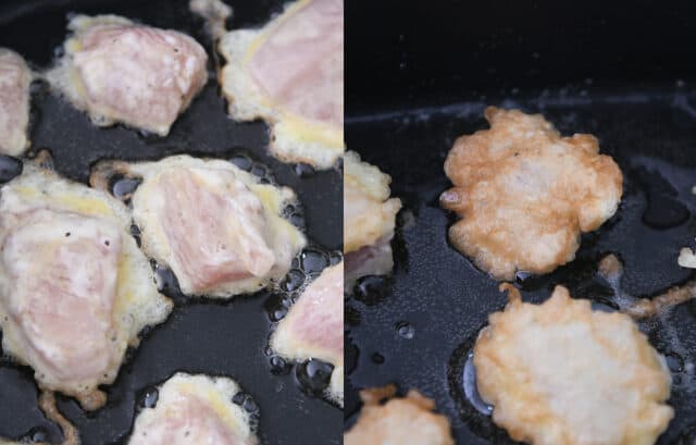 Chicken pieces coated in cornstarch and egg frying in a skillet.