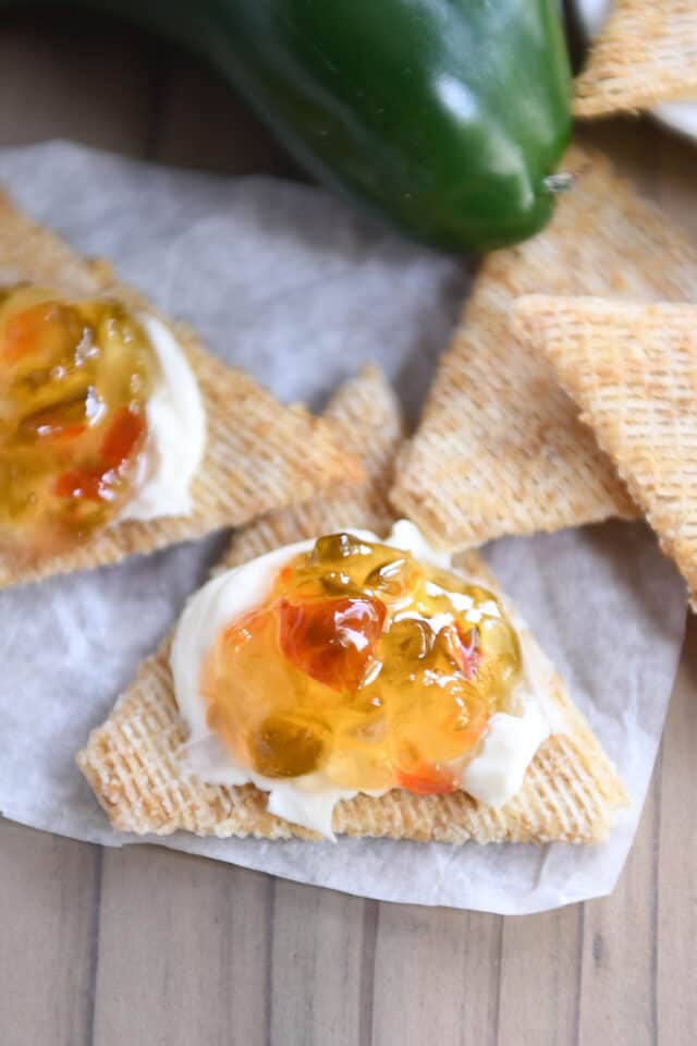 Cracker with cream cheese and hot pepper jelly.