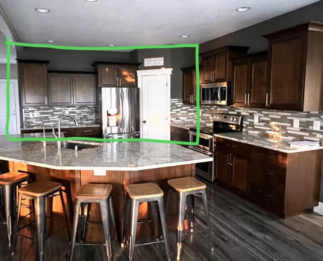 Kitchen with green square around wall.