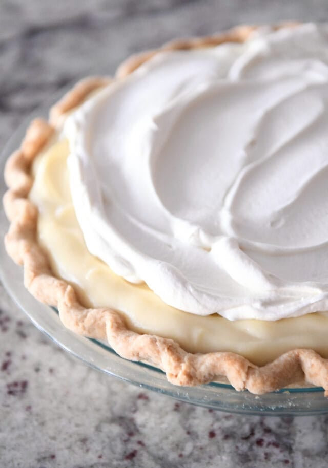 Vanilla custard and whipped cream in baked pie shell.