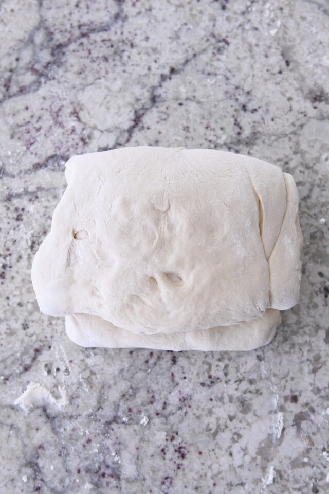 Folded dough for cinnamon sugar croissant bread.