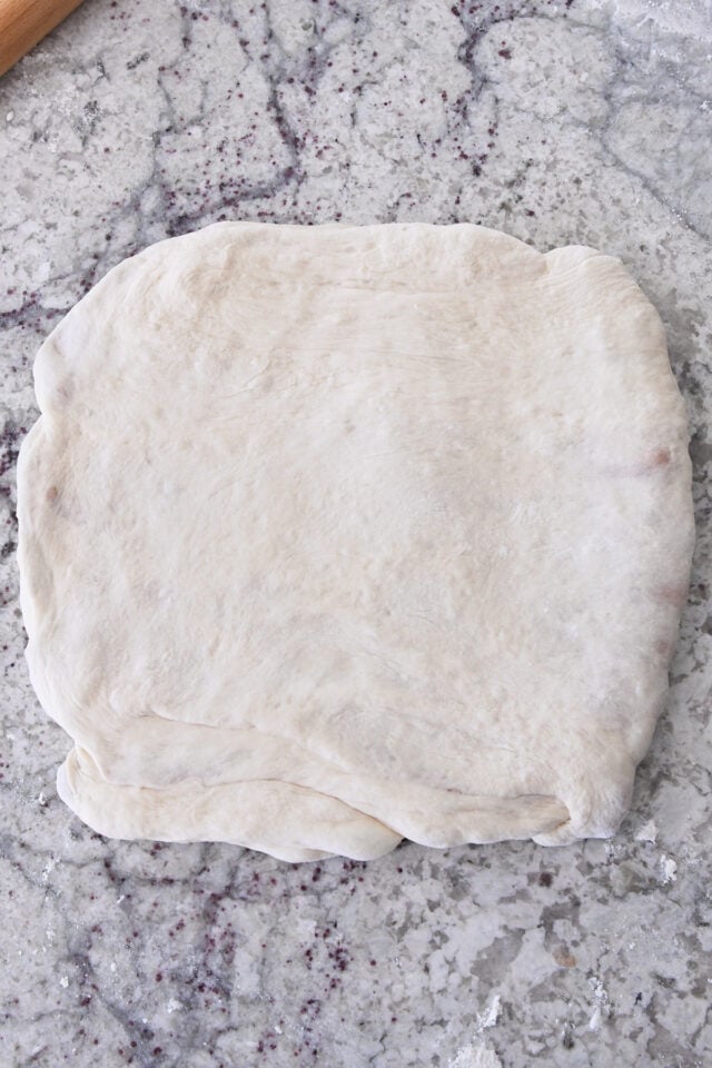 Dough pressed into square.