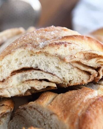 Piece of cinnamon sugar twisted croissant bread.