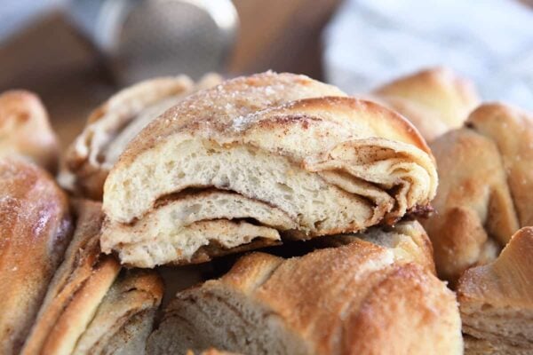 A piece of cinnamon sugar twisted croissant.