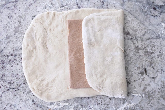 Cinnamon sugar ،er packet folded into French bread dough.