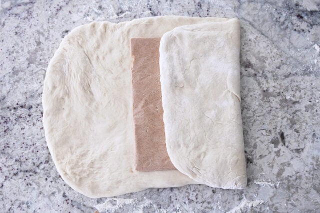 Cinnamon sugar butter packet folded into French bread dough.