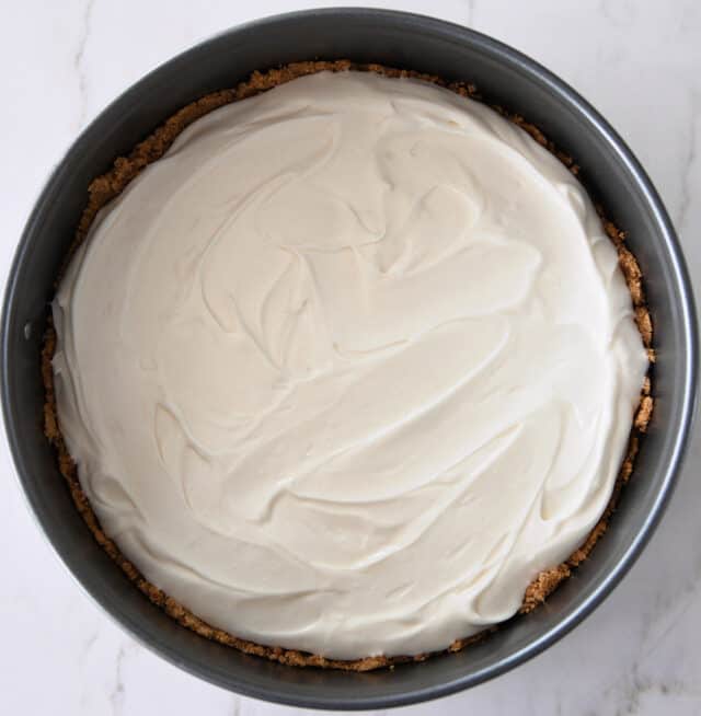 Cheesecake batter in 9-inch springform pan.