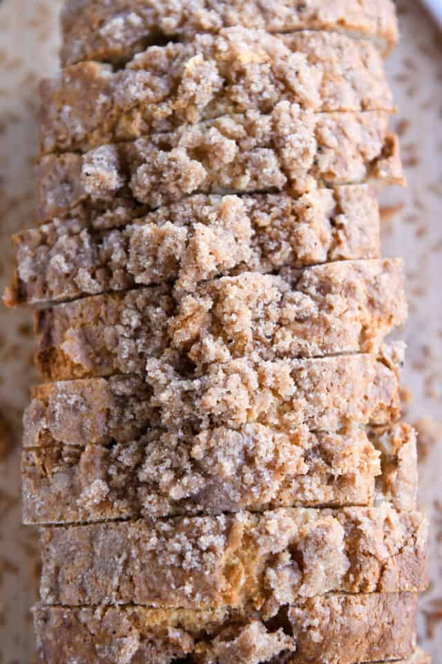 Top down view of seven slices of cream cheese banana bread with cinnamon streusel.