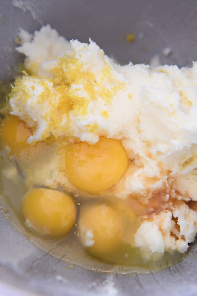 Eggs, butter, lemon zest and vanilla in stainless bowl.