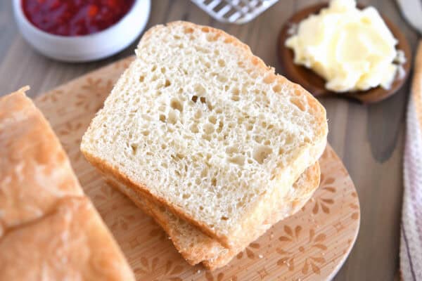 English muffin bread on wood cutting board.