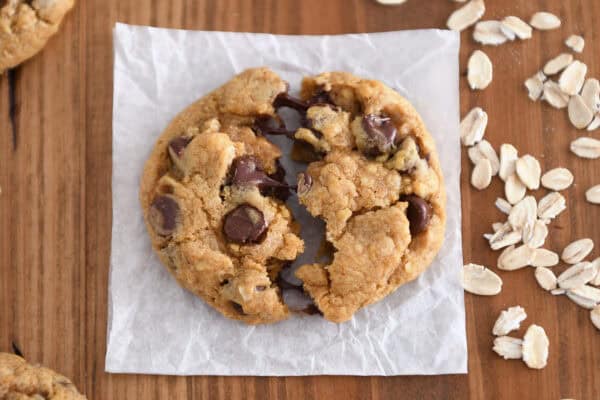Top-down view of pumpkin oatmeal chocolate chip cookies splits half in half.