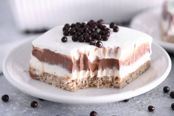 Take a bite from the chocolate pudding dessert on a white plate.