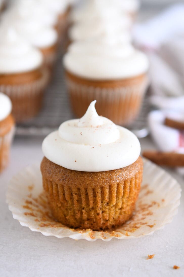 No-Spread Pumpkin Cupcakes topped with Whed Cream Cheese Frosting.