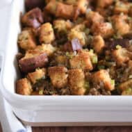 White 9X13-inch pan with baked sausage and herb stuffing.