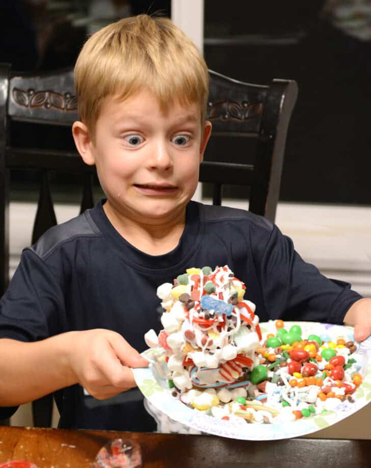 Child decorating gingerbread.