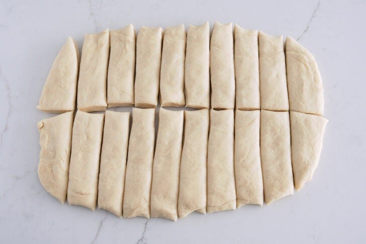 Dough pressed into thick rectangle and cut into 20 strips.