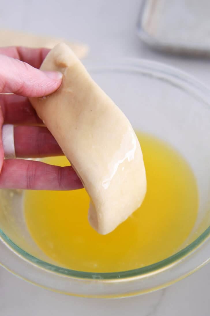 Piece of dough dipped in melted butter.