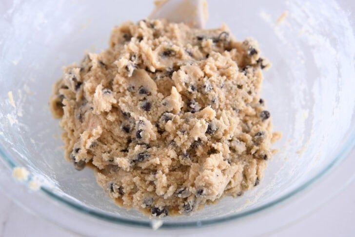 Glass bowl with chocolate chip cookie dough.