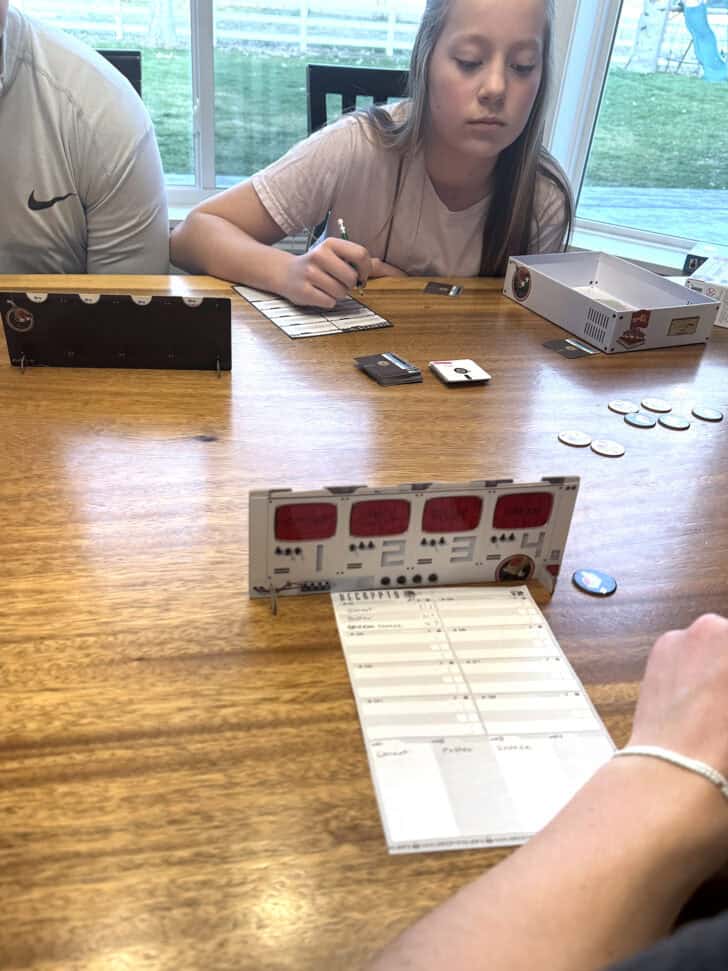 Playing Decrypto game as a family.