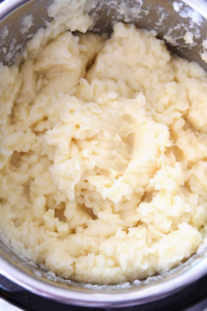 Top down view of an Instant Pot with creamy mashed potatoes.