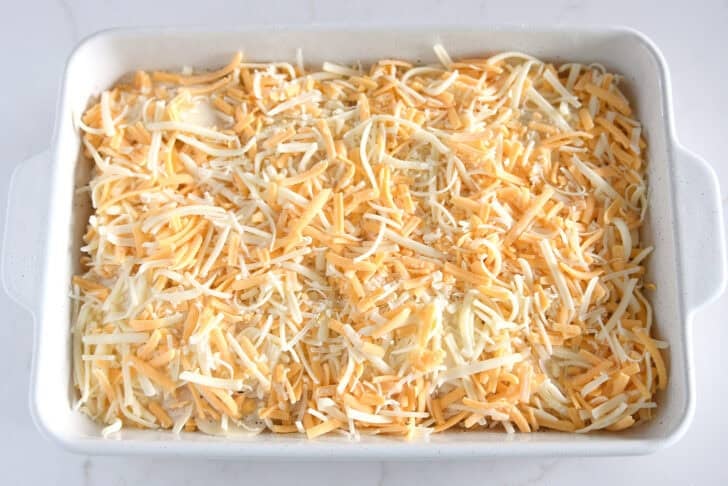 Shredded cheese layered over thin slices of au gratin potatoes.