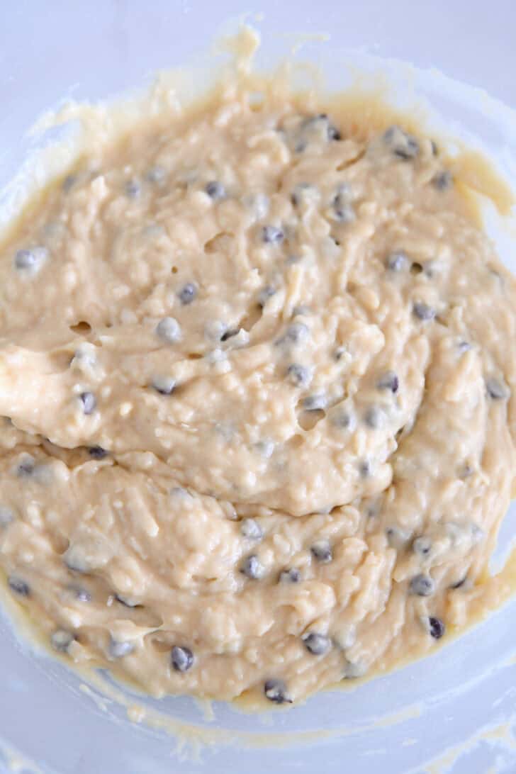 Almond coconut chocolate chip muffin batter in a glass bowl.