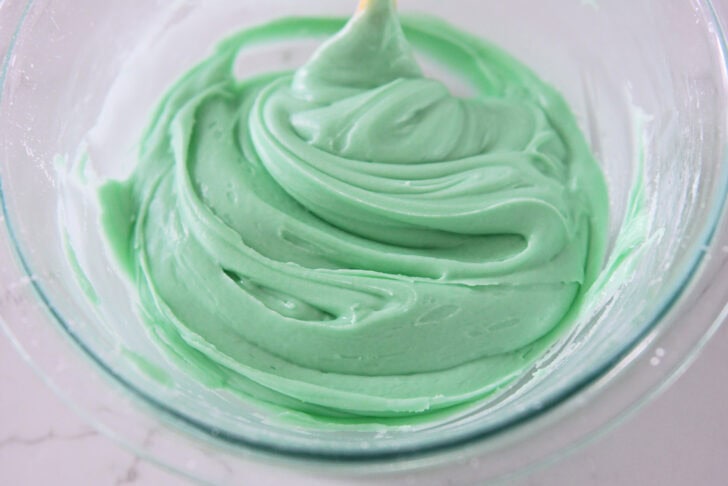 Glass bowl with green mint frosting.