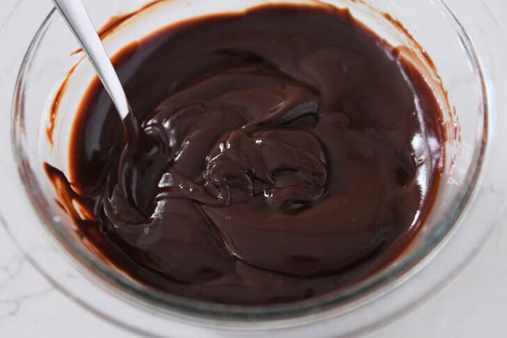 Glass bowl with thick chocolate ganache.