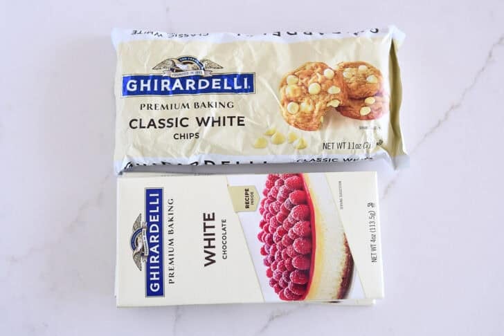 Ghirardelli white bar chocolate and bag of white chocolate chips.