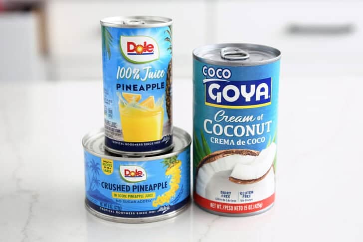 Can of pineapple juice, can of crushed pineapple, can of cream of coconut.