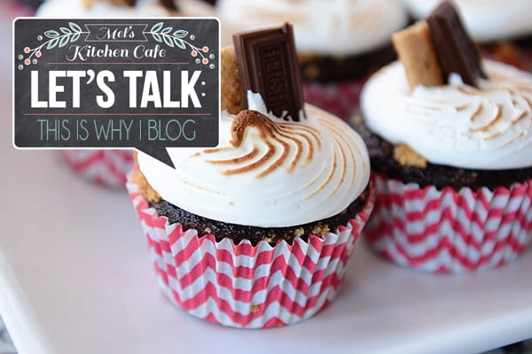 Meringue-topped chocolate cupcakes with a piece of chocolate sticking out of each one.