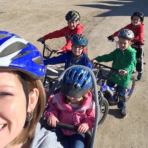 A young family on a bike ride. 