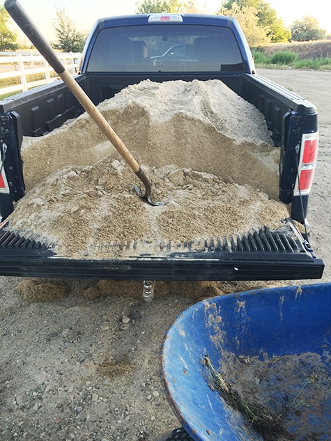 A truckbed full of sand. 