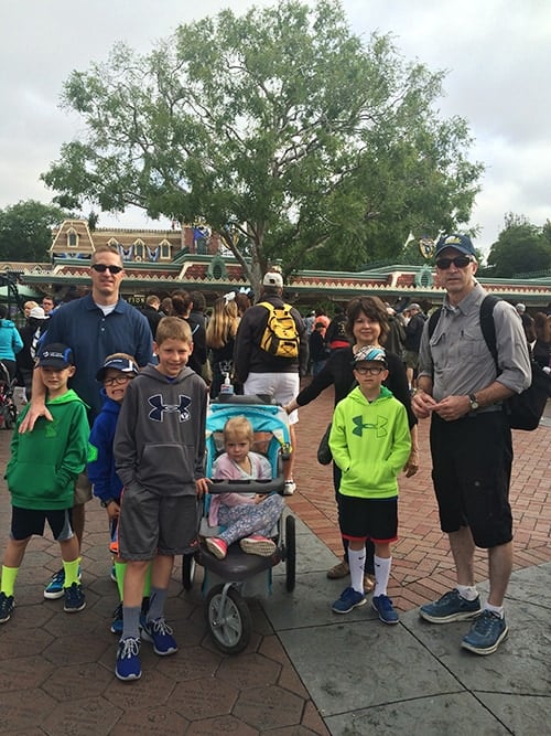 A family taking a picture in Downtown Disney.