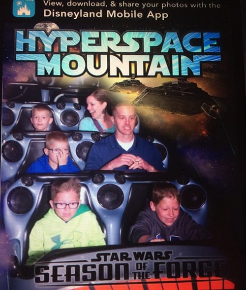 A family on a rollercoaster ride at Disneyland.