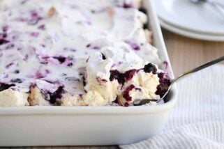 Scooping out a serving of heavenly blueberries and cream angel food cake dessert.