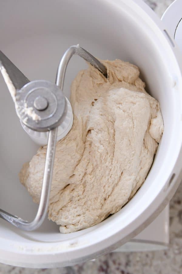 Bagel bread dough in white Bosch mixer.