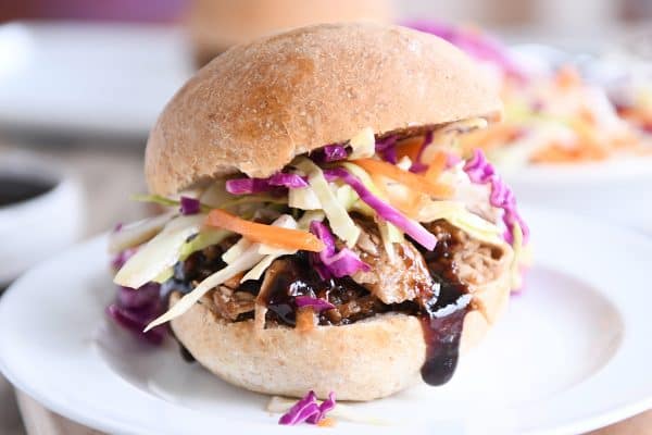 Honey balsamic BBQ pork sandwich on whole beat bun with coleslaw.