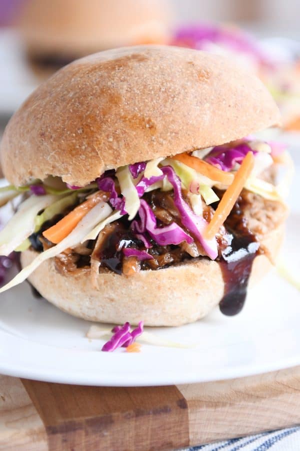 Honey balsamic BBQ pork sandwich on whole beat bun with coleslaw.