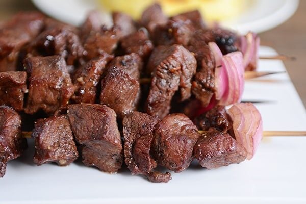 Beef skewer, mustard dressing and fried rosemary