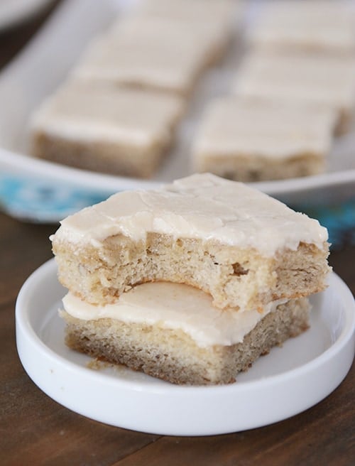 Two banana bars stacked on top of each other with a bite taken out of the top bar. 